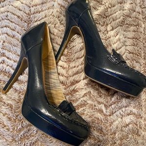 Dark blue loafer style stilettos.